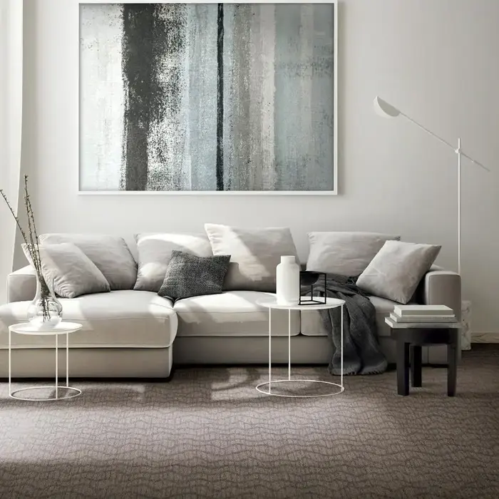 A living room area with carpet flooring 
