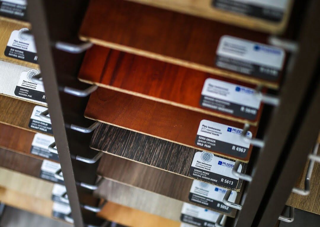a selection of the best waterproof laminate flooring products at a flooring showroom.