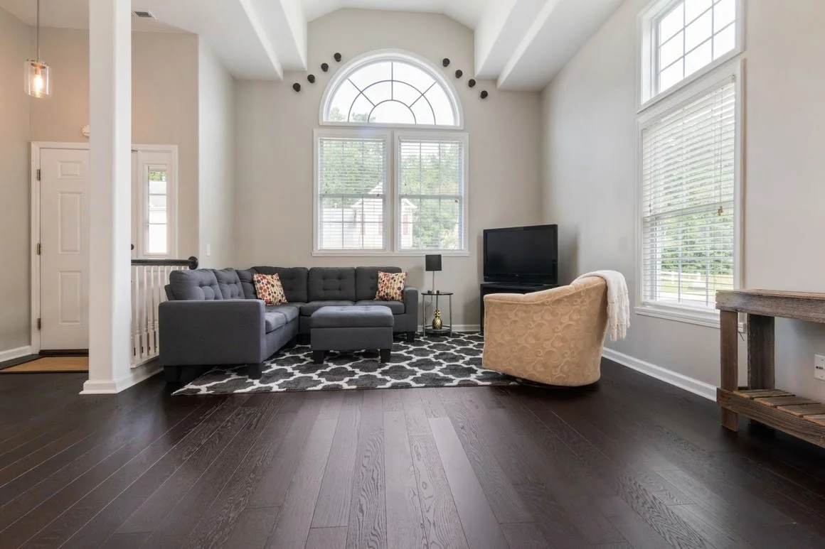 A home featuring newly installed dark hardwood floors.